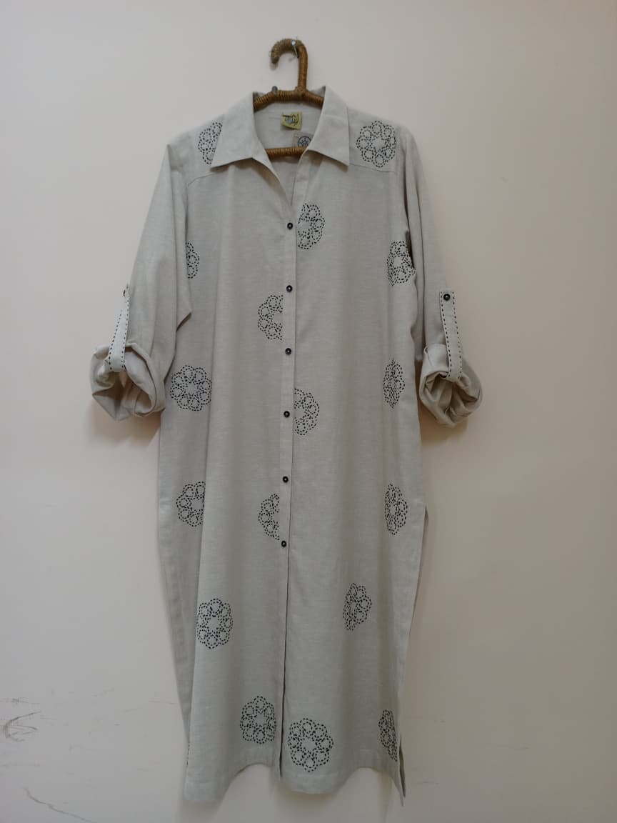 Elegant long shirt featuring delicate hand embroidery. Perfect blend of comfort and timeless style.
